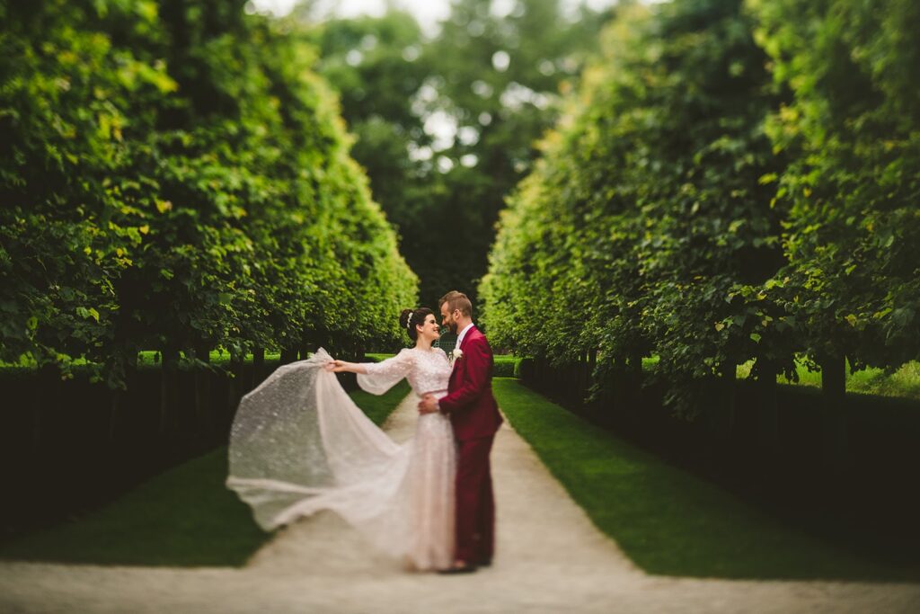 Bride and Groom portrait between gardens.